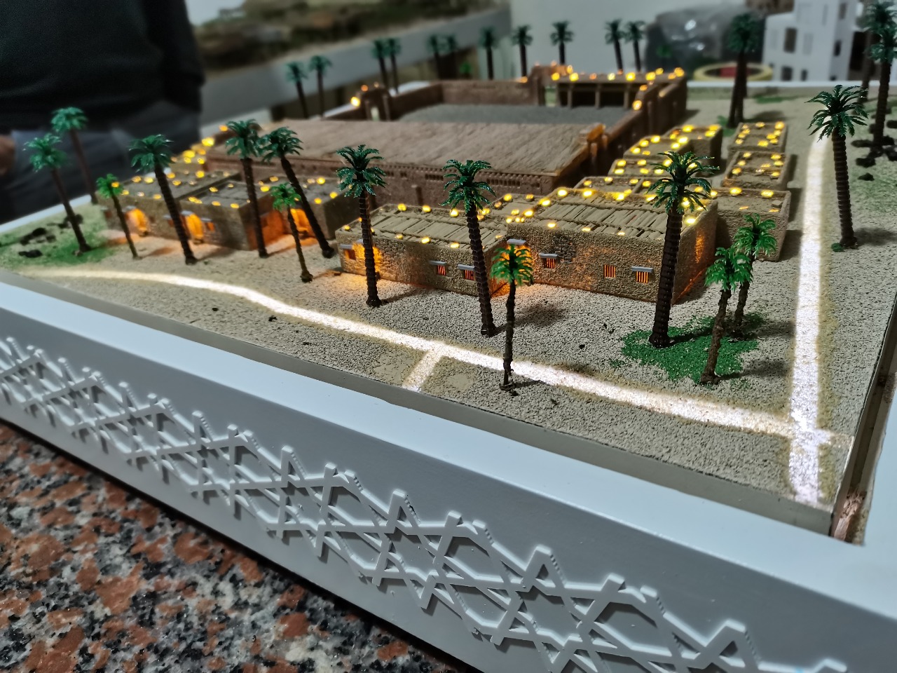 Maquette implementation by model builders in a residential compound